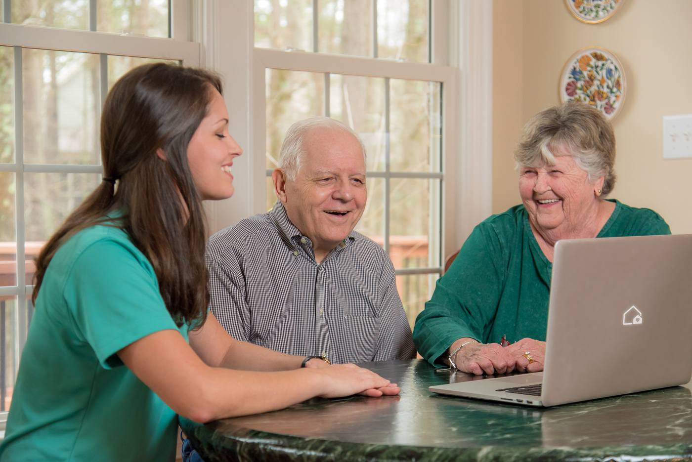 A Smooth Transitions consultant meeting with a family in their home