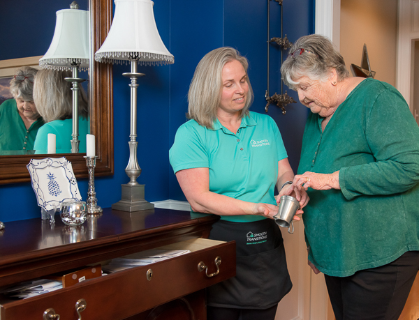 A move manager sorting belongings with a client